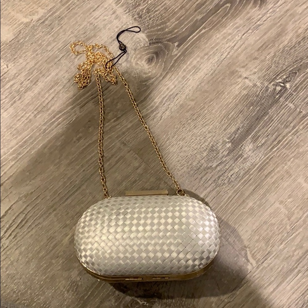 White clutch with gold chain strap